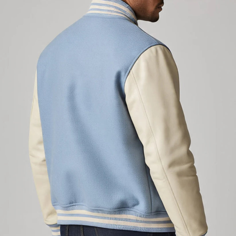 Light blue and beige varsity-style vest on a plain background