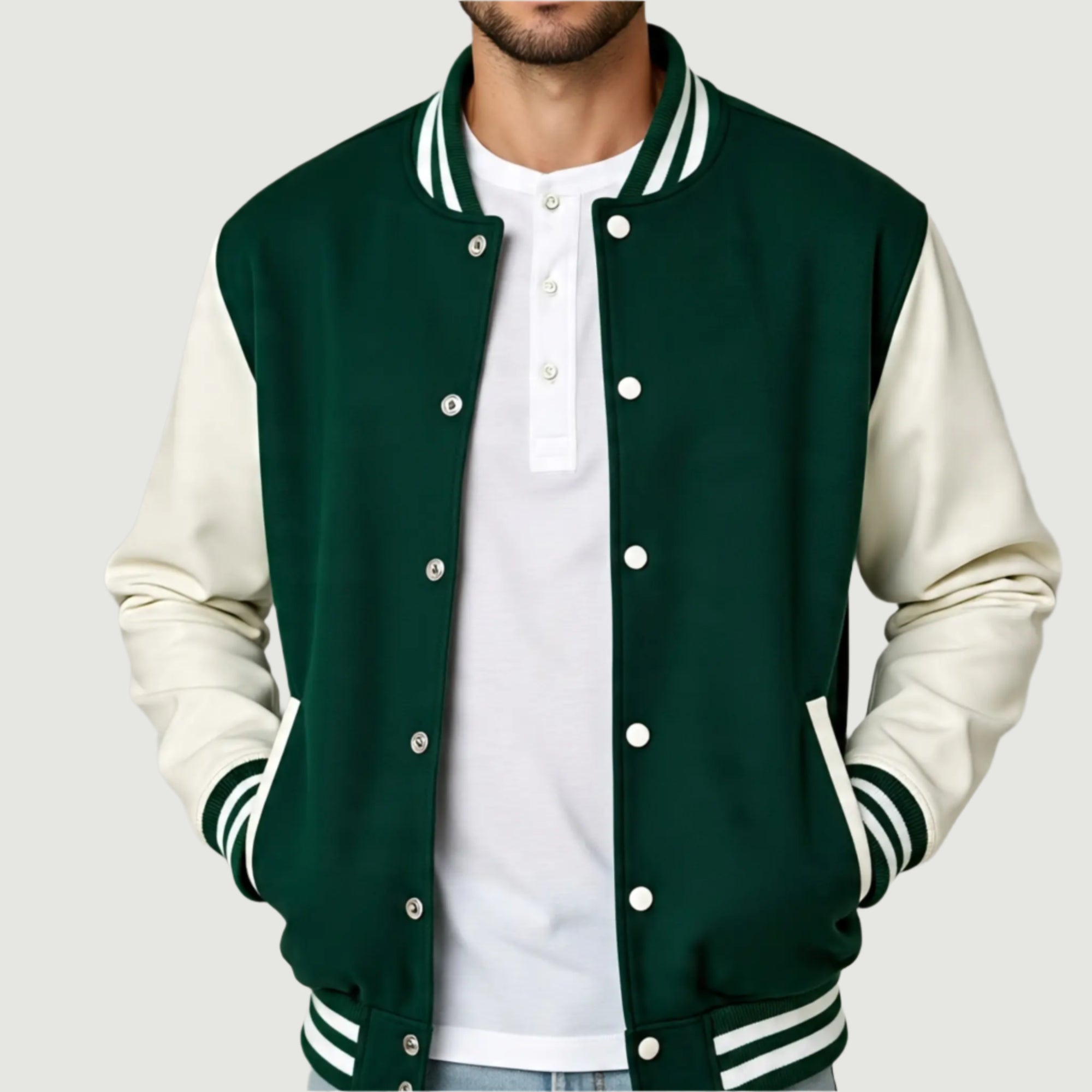 Green and white varsity jacket worn by a person on a plain background