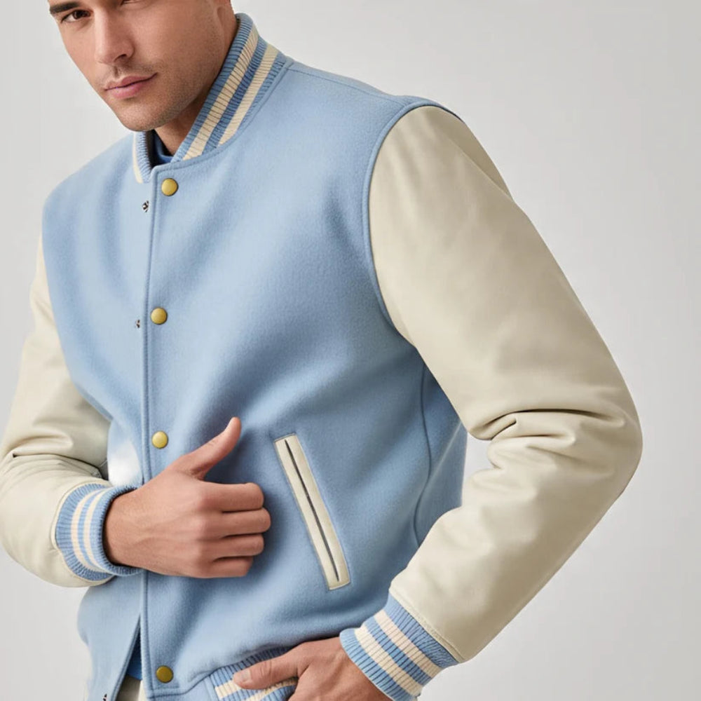 Light blue varsity jacket with white sleeves on a plain background