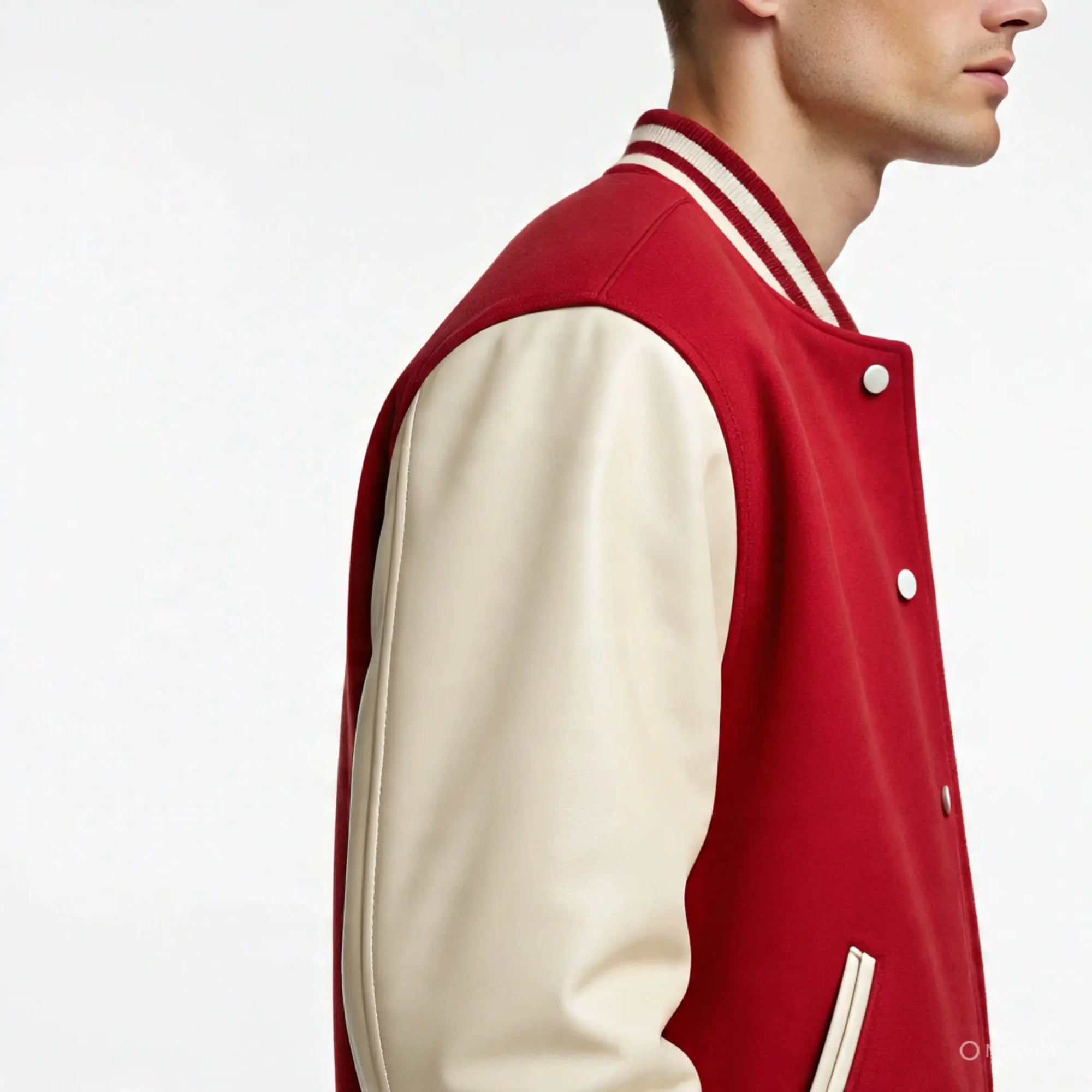 Red and cream varsity jacket worn by a person on a white background